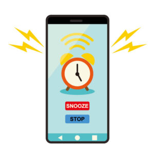 スマホのアラームが鳴っているイメージ画像